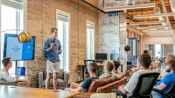 Executive presenting to a room of professionals